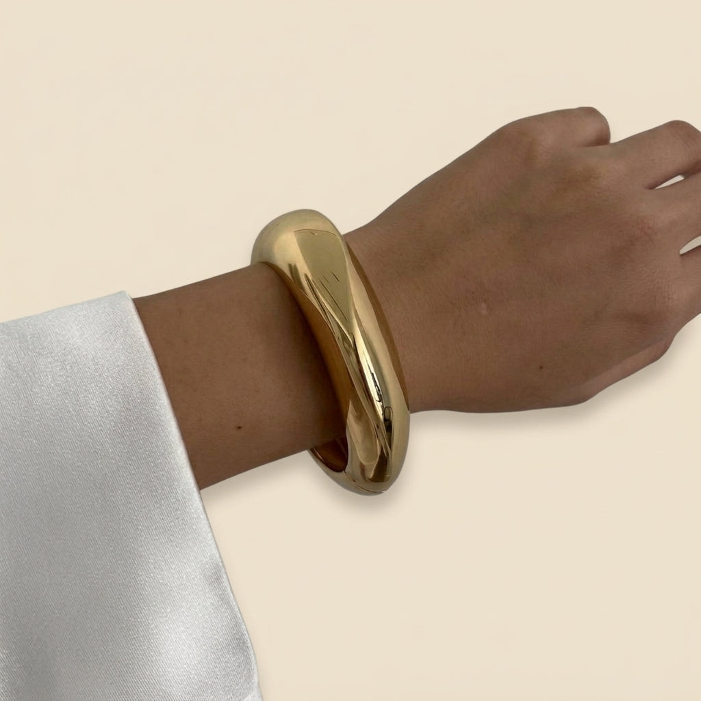 Sculptural Cuff Bangle - smooth dome, gold color, worn