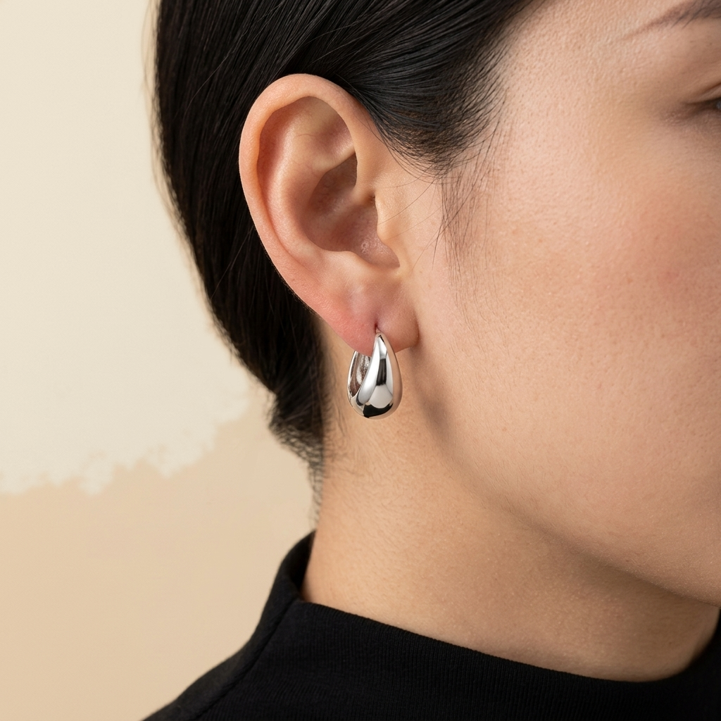 Egg Hoop Earrings - silver color, worn
