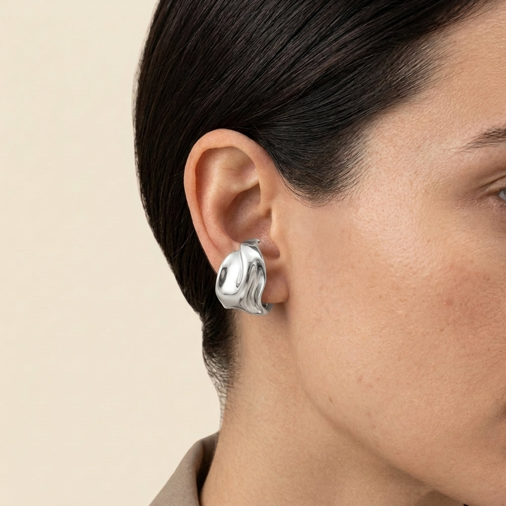 Sculptural Ear Cuff - silver color, worn